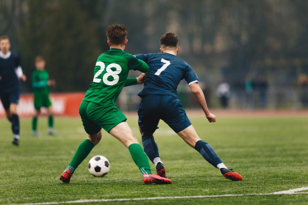 Soccer players battling for possession