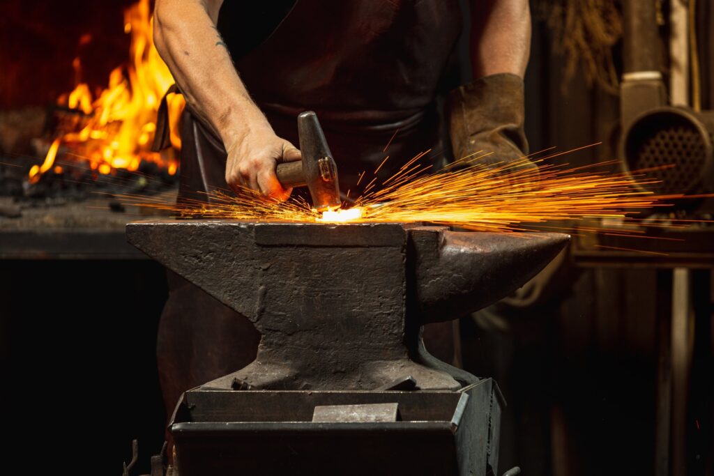 Smith in a forge. Success is built when things get hard. Hard things are good. They teach you how to succeed.